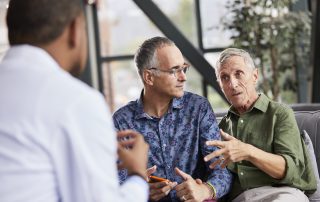 Two men meeting with doctor