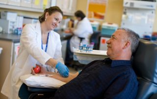 photo of medical professional and male patient