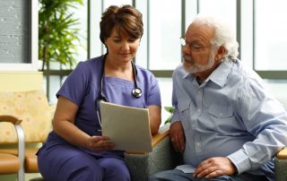 photo medical professional and patient reviewing information