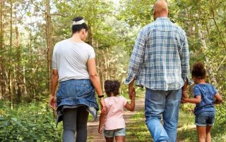 family walking in woods