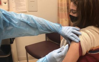 photo of girl getting vaccine