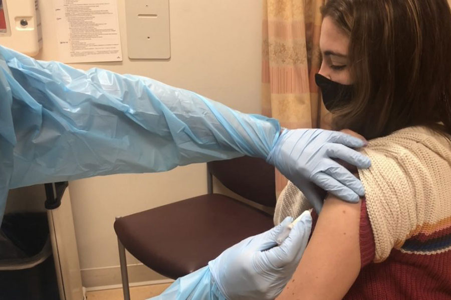 photo of girl getting vaccine