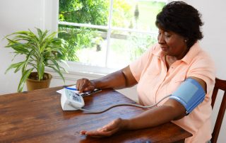 woman checking blood pressure