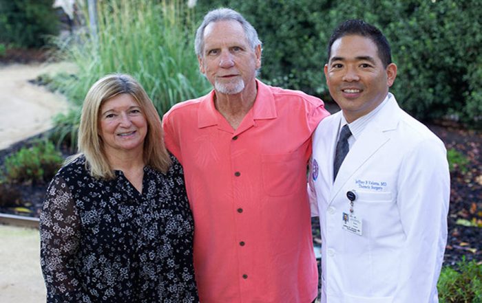 Jerry Maness, center, poses for a photo with his wife, Lori Maness, and Kaiser Permanente thoracic surgeon Jeffrey Velotta, MD.