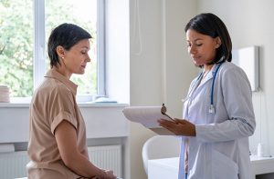 Physician meets with woman patient