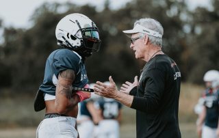 Cameron Sampson talks to a coach during practice.