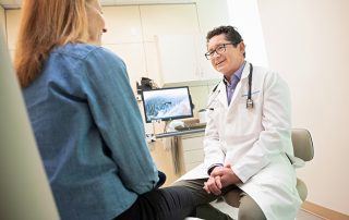 Photo of Permanente physician with patient