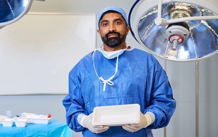 Dr. Naveen Chandra holding plant-based surgical tray