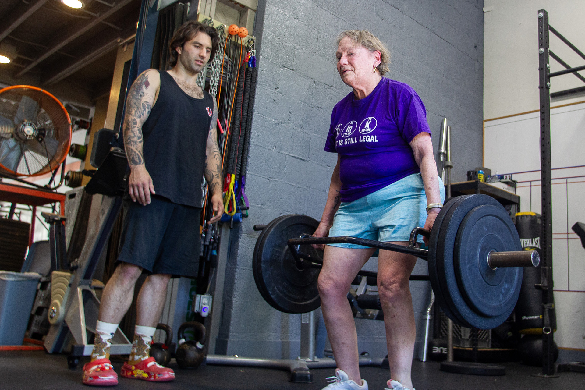 KP member Kathryn Gallagher deadlifts 105 pounds with her CrossFit trainer, Tony Sangimino.